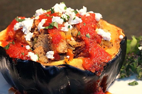 Acorn squash stuffed with seasonal vegetables and grains.