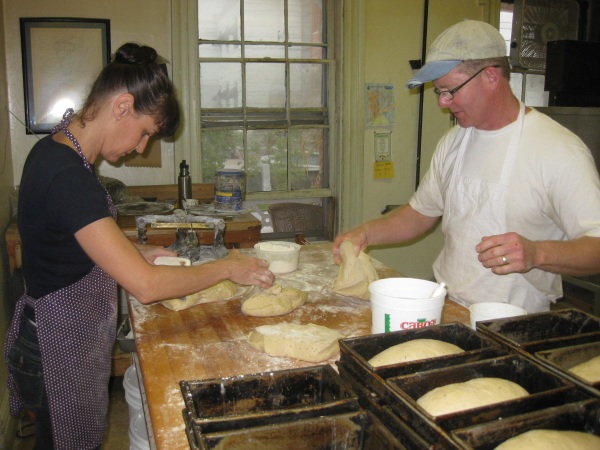 manghies getting dough ready for oven