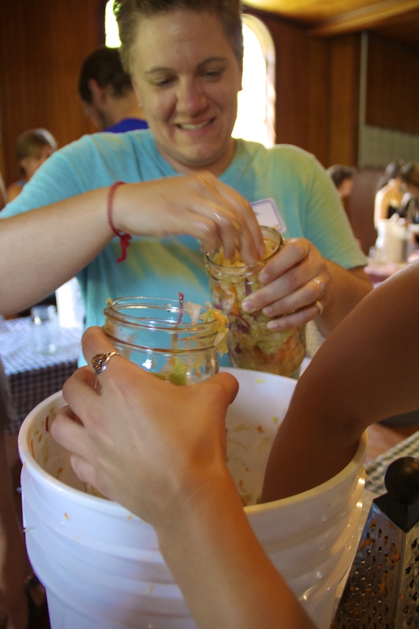 Our fearless leader, HLVT Produce Manager Louella fills a jar